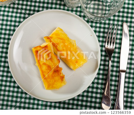 Pancakes stuffed with meat served on platter 123566359