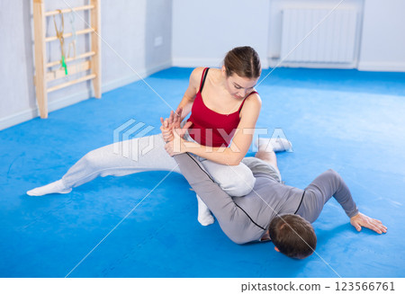 Woman and man practicing self defense techniques 123566761