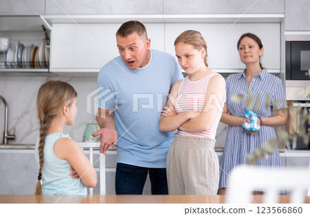 Parents and elder sister scold daughter in kitchen 123566860