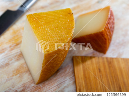View of a pieces of semi-hard cheese 123566899