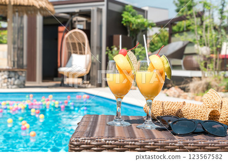 Tropical drinks by the pool (vacation, resort, vacation) 123567582