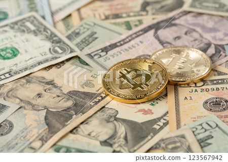 Bitcoin and dollar bills 123567942