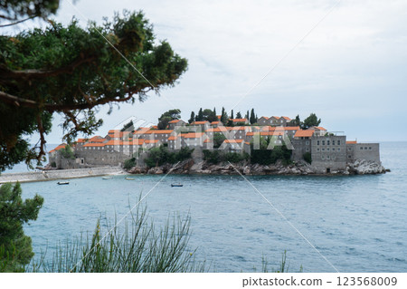 Sveti Stefan private island in Montenegro near Budva. Adriatic Sea Coast travel destination vacation holiday idea. Concept of getting away tourism experiences. Nature driven scenery Sveti Stefan private island in Montenegro near Budva. Adriatic Sea Coast travel destination vacation holiday idea. Concept of getting away tourism experiences. Nature driven scenery 123568009