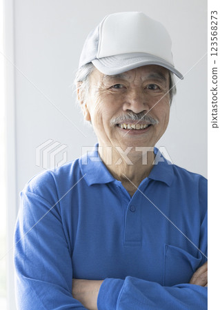 Senior man in work clothes 123568273