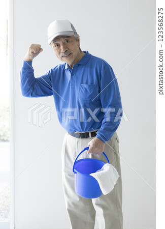 Senior man with cleaning tools 123568275