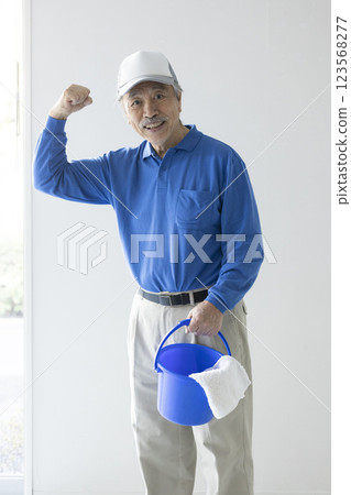 Senior man with cleaning tools 123568277