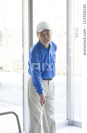 Senior man cleaning 123568280