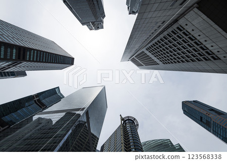 Low-angle building view of the modern office skyscrapers in the financial district of Raffles Place, Singapore. Low-angle building view of the modern office skyscrapers in the financial district of Raffles Place, Singapore. 123568338