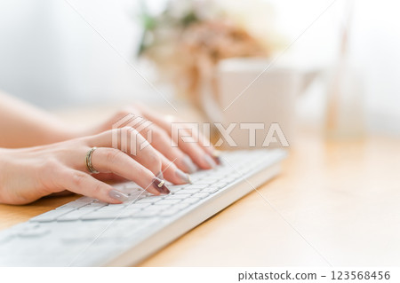 Woman with nails using a computer (work, gel nails, fashion designer) Woman with nails using a computer (work, gel nails, fashion designer) 123568456