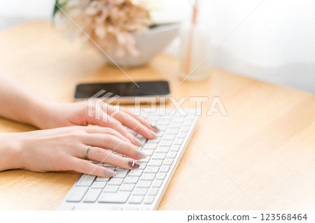 Woman with nails using a computer (work, gel nails, fashion designer) 123568464