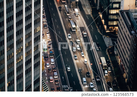 Urban Evening Cityscape with Traffic on Busy Roadway and Tall Buildings, Tokyo Dec 4 2024 Urban Evening Cityscape with Traffic on Busy Roadway and Tall Buildings, Tokyo Dec 4 2024 123568573