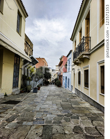 Cobblestone street in a historic neighborhood with colorful buildings and overcast sky Cobblestone street in a historic neighborhood with colorful buildings and overcast sky 123571353