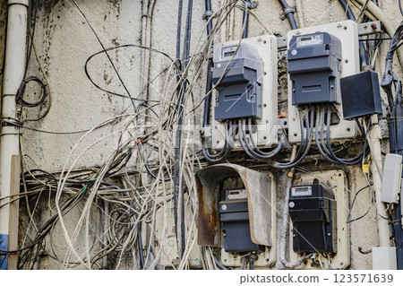 Messy wiring, power distribution equipment, multi-tenant building Messy wiring, power distribution equipment, multi-tenant building 123571639