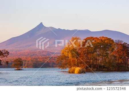 Autumn in Hokkaido: Autumn leaves at Onuma Park, Lake Onuma and Mt. Hokkaido Komagatake at dusk 123572346