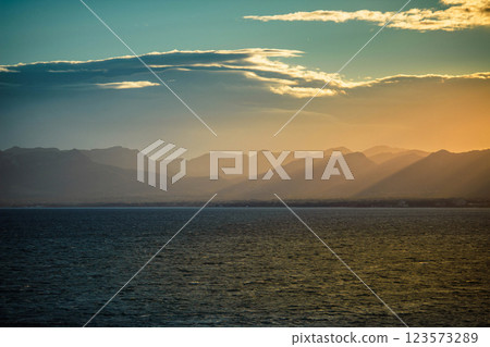 Colorful sunset over spanish coastline. Seascape with sun rays Colorful sunset over spanish coastline. Seascape with sun rays 123573289