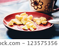 Sliced apple on a plate with a cup of coffee . Selective focus. Digital painting. 123575356