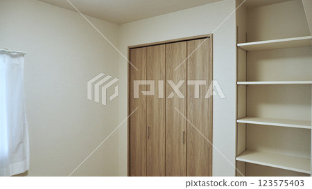 Storage and shelves in a newly built apartment 123575403