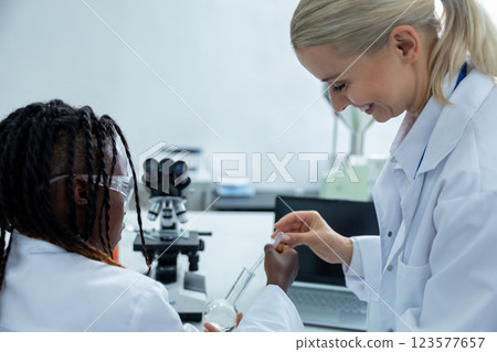 People working in a school laboratory and looking involved 123577657