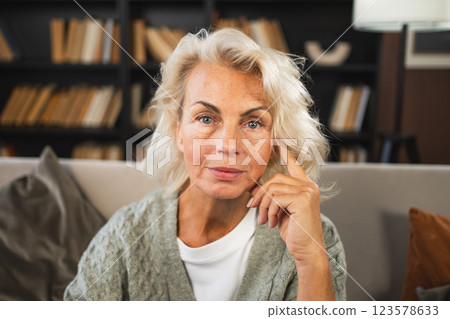 Portrait of confident stylish European middle aged senior woman. Older mature 60s lady smiling at home. Happy attractive senior female looking camera close up face headshot portrait. Happy people 123578633