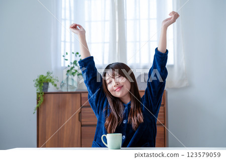 Young woman relaxing in the living room Young woman relaxing in the living room 123579059