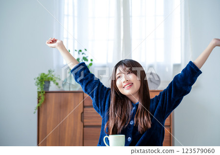 Young woman relaxing in the living room Young woman relaxing in the living room 123579060