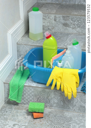 Household cleaning products and items for cleaning tile in house. Cleaning and cleanliness. Household cleaning products and items for cleaning tile in house. Cleaning and cleanliness. 123579532