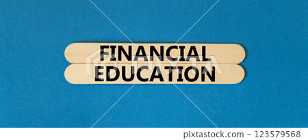 Financial education symbol. Concept words Financial education on beautiful wooden stick. Beautiful blue paper background. Business Financial education concept. Copy space. Financial education symbol. Concept words Financial education on beautiful wooden stick. Beautiful blue paper background. Business Financial education concept. Copy space. 123579568