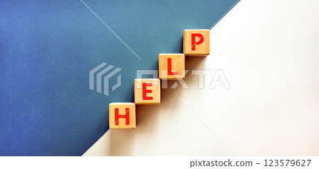 Help symbol. Concept word Help on beautiful wooden blocks. Beautiful white and blue background. Business, lifestyle, support and help concept. Copy space. Help symbol. Concept word Help on beautiful wooden blocks. Beautiful white and blue background. Business, lifestyle, support and help concept. Copy space. 123579627