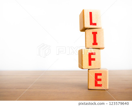 Life symbol. Concept word Life on beautiful wooden blocks. Beautiful wooden table white background. Business, lifestyle, support and life concept. Copy space. 123579640