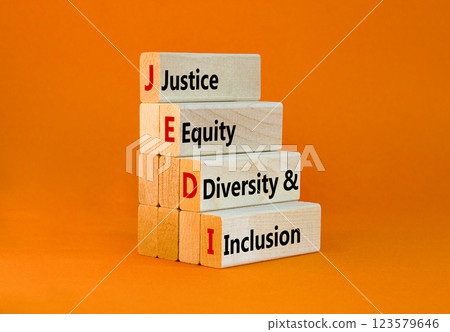 Justice equity diversity inclusion symbol. Concept words JEDI Justice Equity Diversity Inclusion on blocks. Beautiful orange background. Business justice equity diversity inclusion concept. Copy space Justice equity diversity inclusion symbol. Concept words JEDI Justice Equity Diversity Inclusion on blocks. Beautiful orange background. Business justice equity diversity inclusion concept. Copy space 123579646