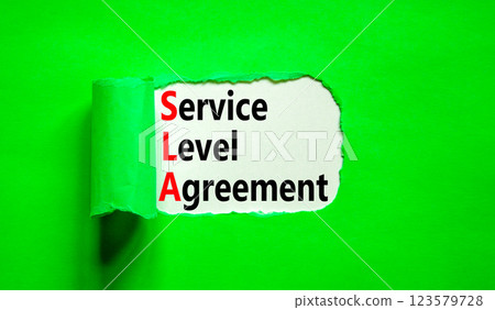SLA service level agreement symbol. Concept words SLA service level agreement on beautiful white paper. Beautiful green paper background. Business SLA service level agreement concept. Copy space. 123579728