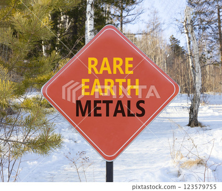Rare earth metals symbol. Concept words Rare earth metals on beautiful red road sign. Beautiful winter forest background. Business and rare earth metals concept. Copy space. Rare earth metals symbol. Concept words Rare earth metals on beautiful red road sign. Beautiful winter forest background. Business and rare earth metals concept. Copy space. 123579755