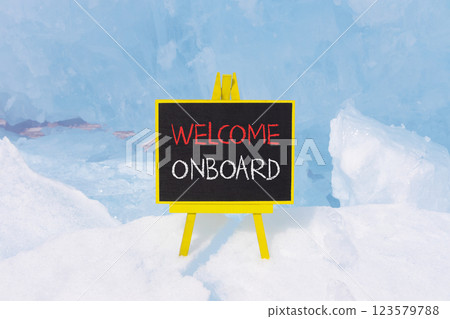 Welcome onboard symbol. Concept words Welcome onboard on beautiful yellow black blackboard. Beautiful blue ice background. Business, motivational welcome onboard concept. Copy space. 123579788