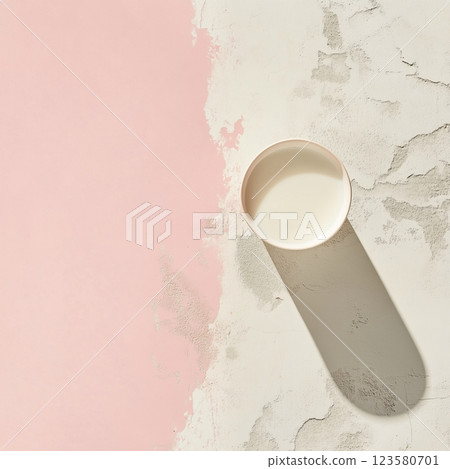 Minimalistic background with milk pouring into a glass 123580701