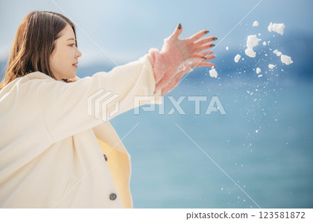 Portrait of a woman with blue sky and lake Portrait of a woman with blue sky and lake 123581872