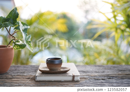 Old vintage Tea cup at the cozy garden, chilling outdoor relaxing Old vintage Tea cup at the cozy garden, chilling outdoor relaxing 123582057