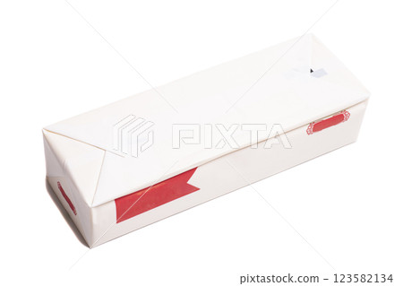 Stick of wrapped butter isolated on white background. Stick of wrapped butter isolated on white background. 123582134