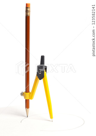 Yellow compass with pencil isolated on white background Yellow compass with pencil isolated on white background 123582141
