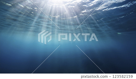 Underwater background, ocean or sea surface seen from under water. Rays of light, abstract marine backdrop. Nature landscape, beams blurred 123582159