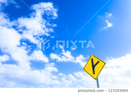 Scenery with a refreshing blue sky and signs indicating straight ahead and right curve Scenery with a refreshing blue sky and signs indicating straight ahead and right curve 123583004