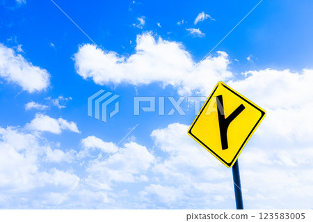 Scenery with a refreshing blue sky and signs indicating straight ahead and right curve 123583005