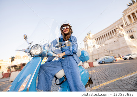 Stylish Woman Exploring Rome on a Retro Scooter Stylish Woman Exploring Rome on a Retro Scooter 123583682
