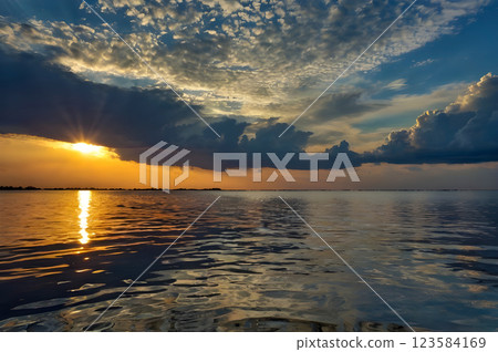 sunset over the sea sunset over the sea 123584169