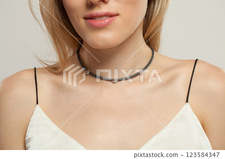 Shiny jewelry necklace choker on beautiful female neck 123584347