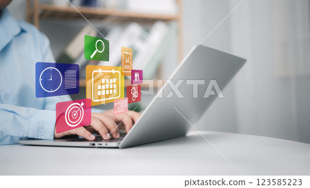 Calendar for monthly appointments and planning, Managing his business schedule, Hand marking dates on virtual calendar, Setting reminders for important appointments, Agenda plan and schedule event. 123585223