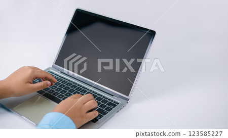 Mockup screen blank, Concept analysis, Growth development investment, Stock market, Strategy market plan, Stock fluctuation, Businessman fingers typing blank screen laptop computer in office. 123585227