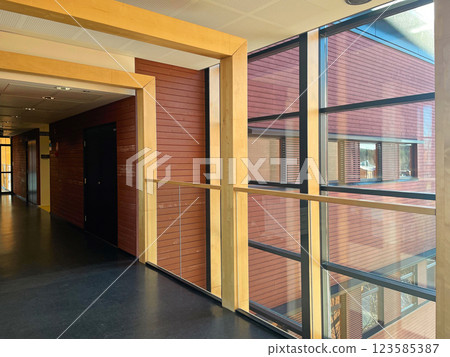Empty office corridor with glass walls 123585387