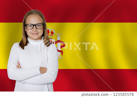 Happy young girl on Spanish flag background. Education and childhood in Spain concept 123585578