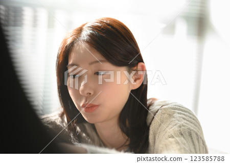 A woman thinking in the morning sunlight 123585788