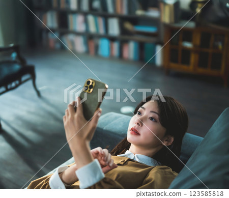 Woman operating a smartphone 123585818